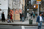 standing on a street corner, about to kiss, but not